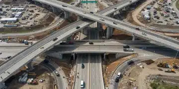 Modern highway interchange under construction, symbolizing infrastructure bill progress